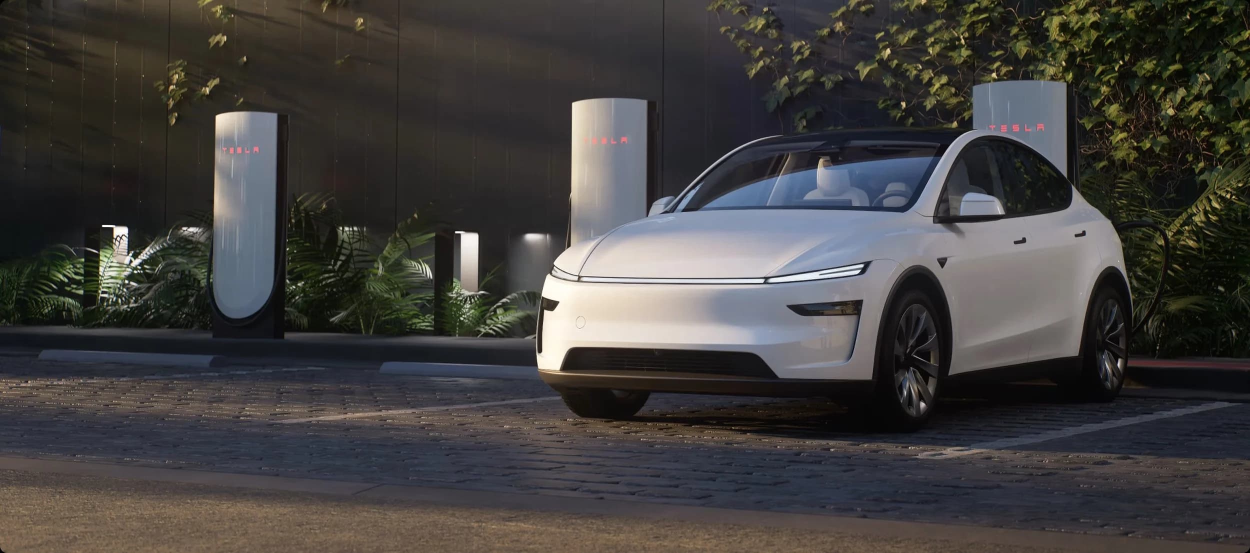 Uncamouflaged affordable Model Y on a Texas highway showing simplified front fascia and 18-inch aero wheels