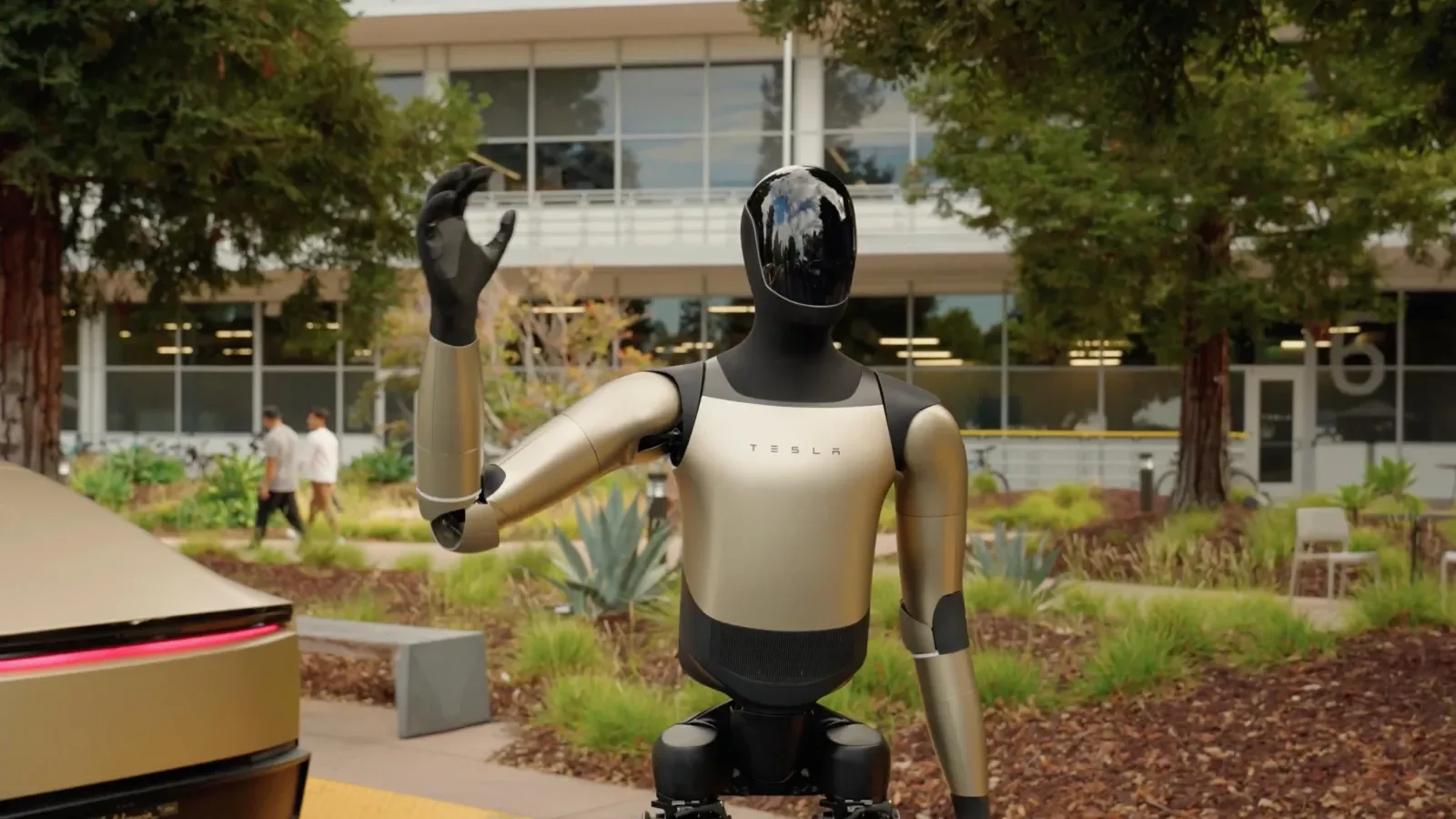 Tesla Optimus humanoid robot showing its dexterous five-fingered hand with 22 degrees of freedom