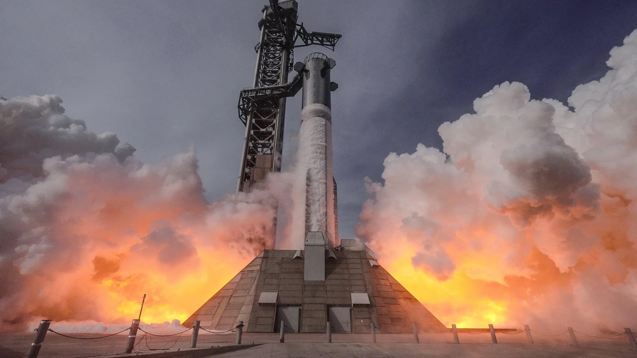 Starship Version 3 booster and Raptor 3 engines during a full 33-engine static fire test at SpaceX