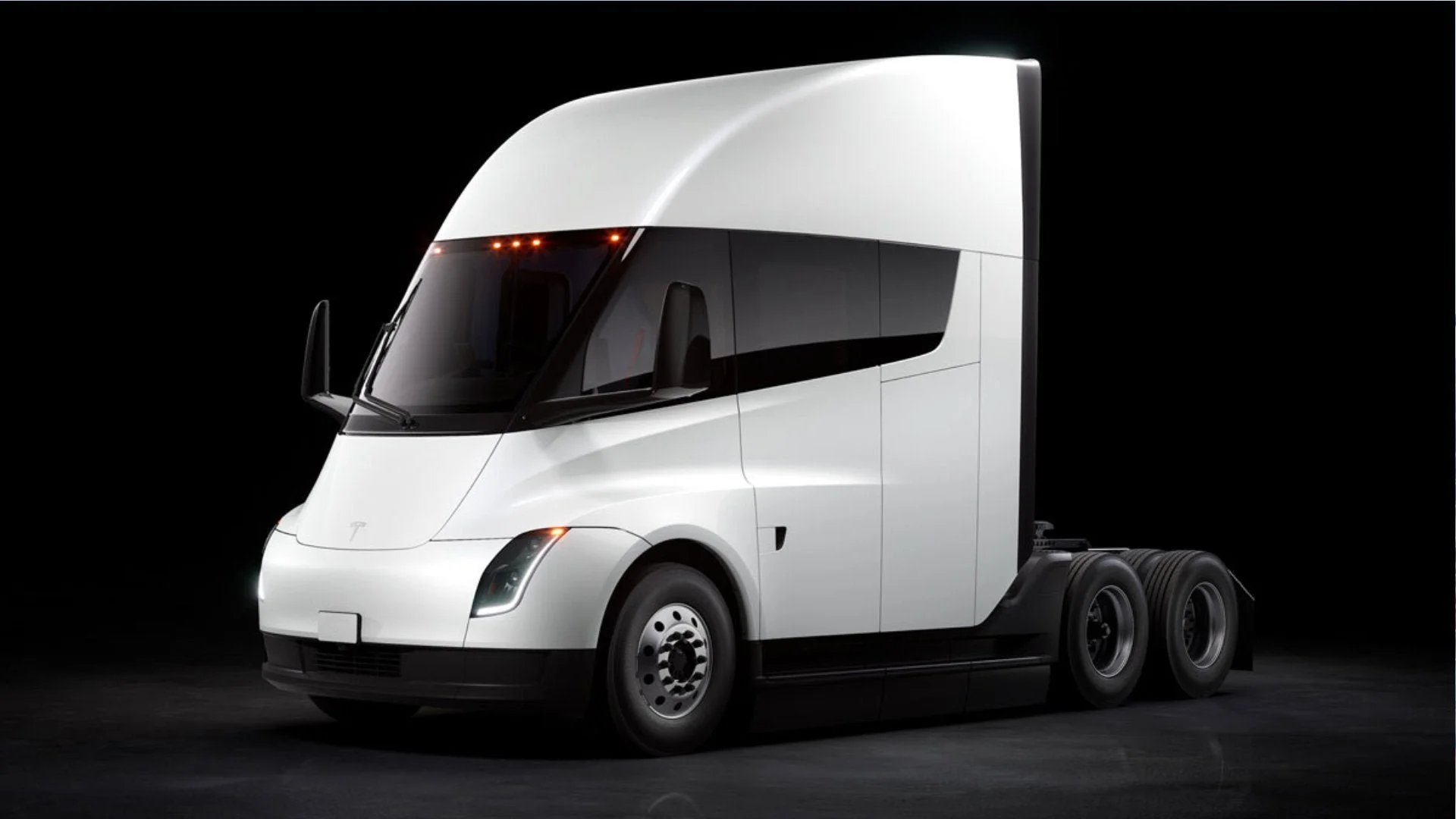 Tesla Semi production trucks lined up at the Nevada factory hauling freight