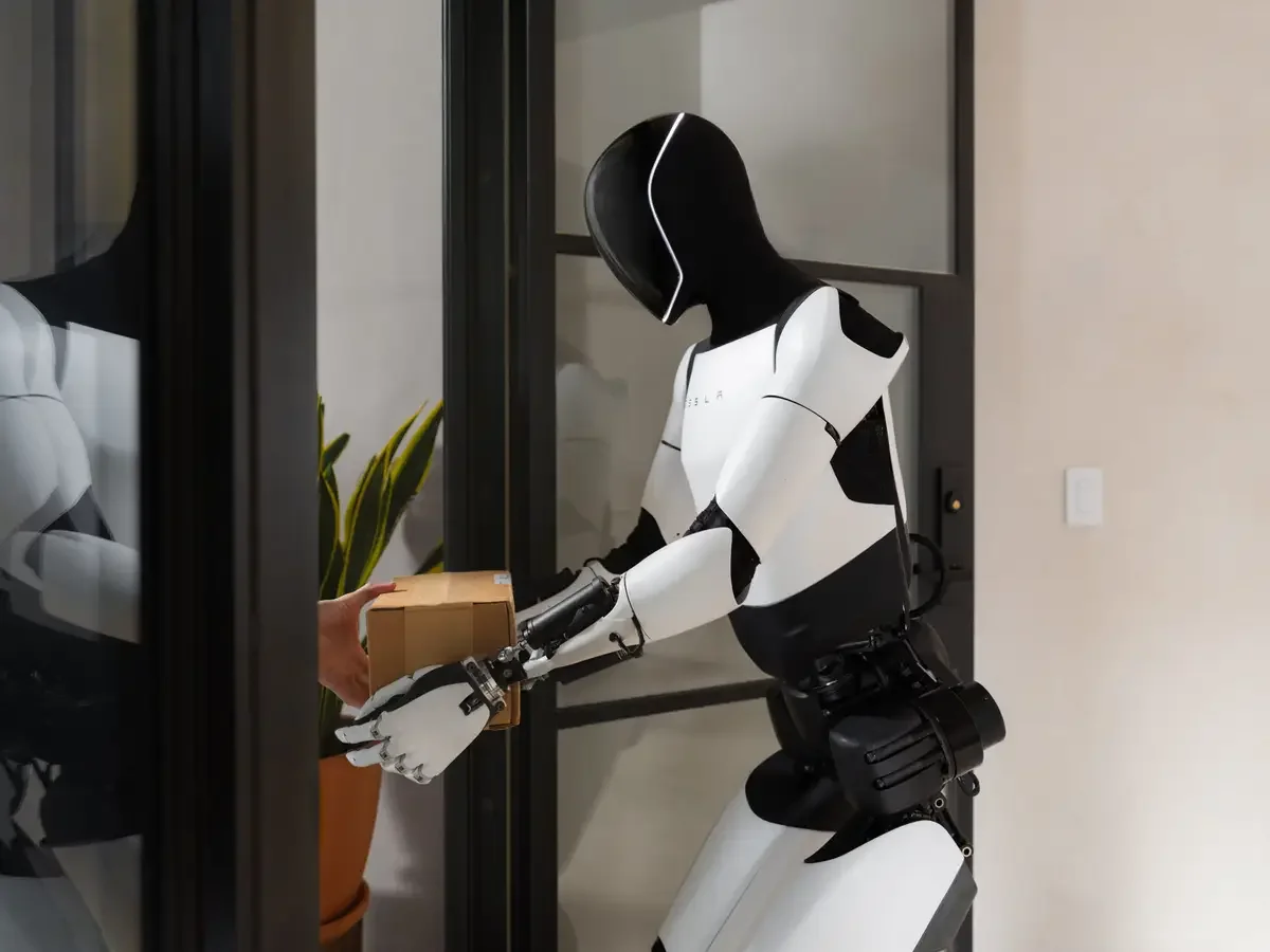 Optimus humanoid robots working in a factory, illustrating the humanoid robot labor market opportunity