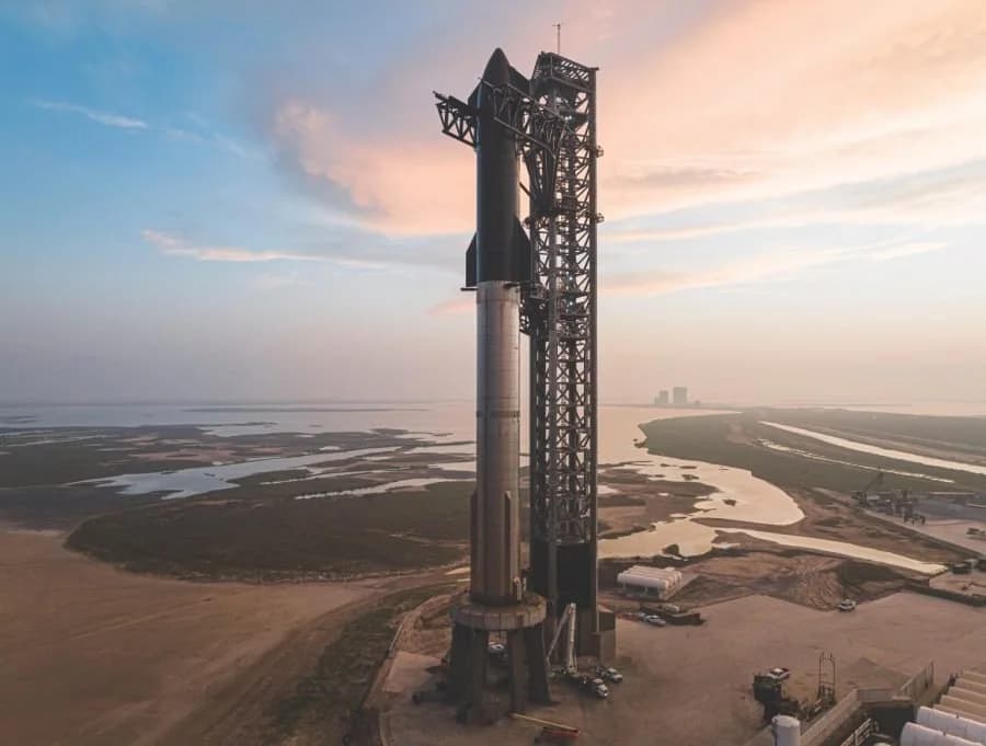 SpaceX Starship booster caught by launch tower arms, marking the drop in starship launch costs