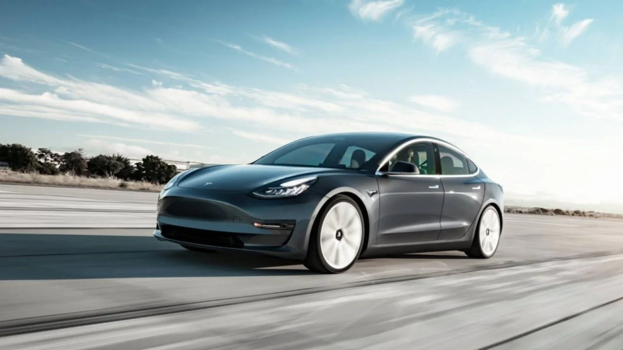 Tesla vehicle running FSD software with the Tesla FSD subscription pricing shift illustrated