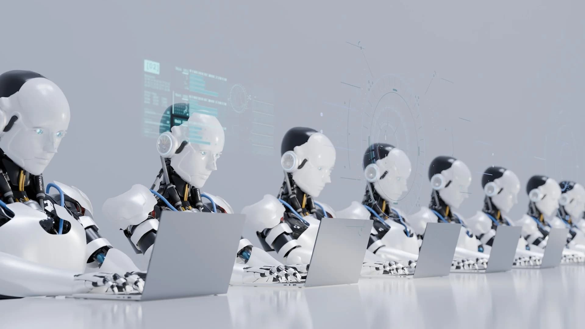 Empty office desks after AI layoffs, with a robot arm at a workstation replacing a human worker