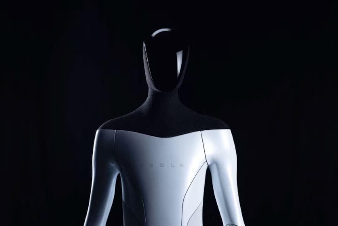 Tesla Optimus robot demonstrating precise hand movements as it handles an object in a demo