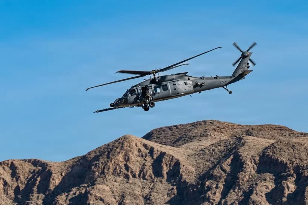 US special operations helicopter over Iran's Zagros Mountains during a combat search and rescue mission at night
