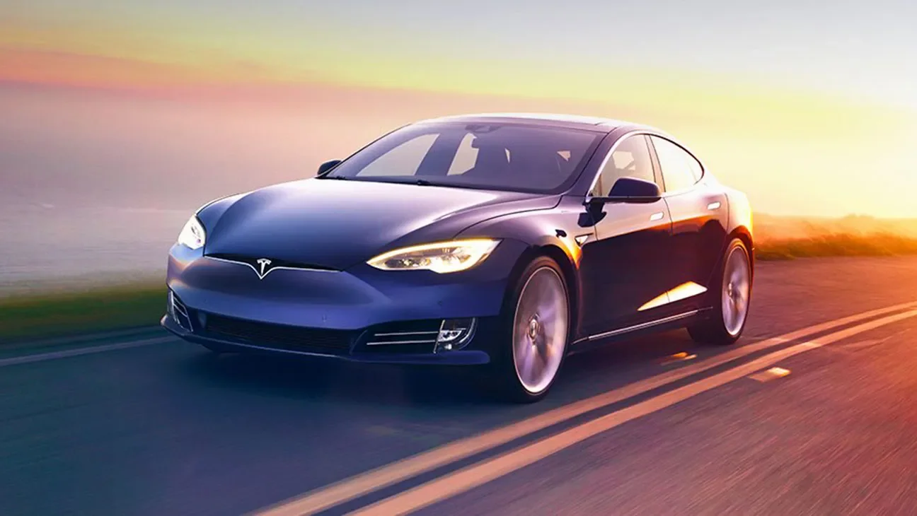 Tesla full self-driving robotaxi navigating a busy city intersection with no driver at the wheel