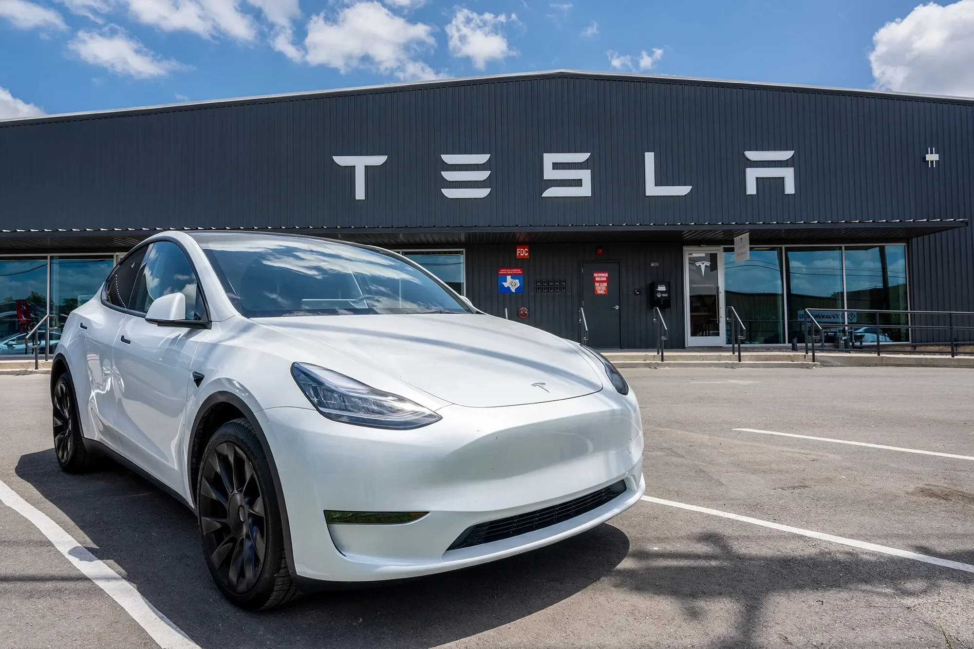 Tesla robotaxi based on a Model Y driving through Austin streets with no driver behind the wheel