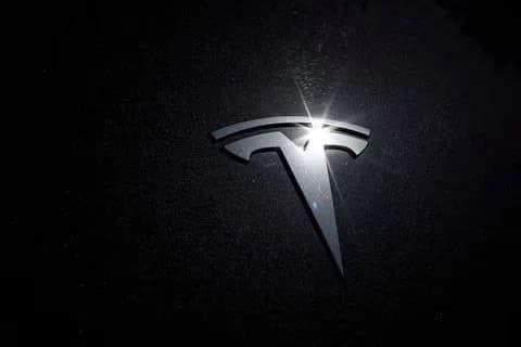 Tesla Model Y robotaxi driving through Austin streets showing the tesla robotaxi austin network expansion