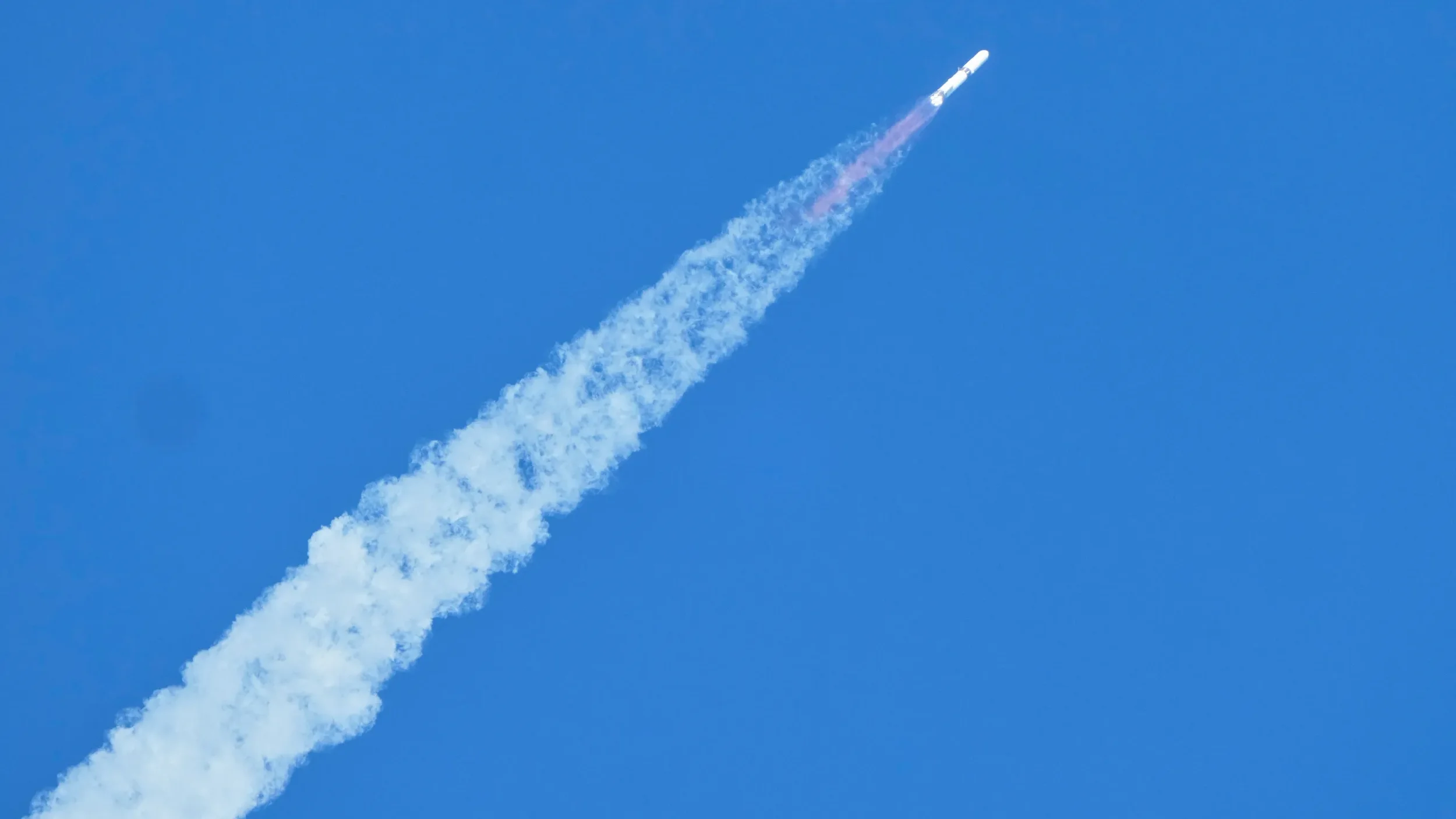 Blue Origin New Glenn booster landing on a drone ship after launching NASA's Escapade Mars satellites