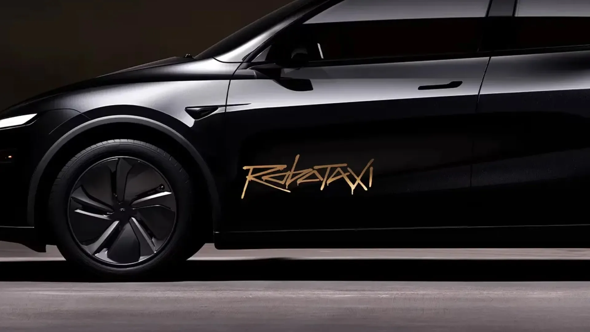 Tesla robotaxi expansion shown by driverless Model Y picking up riders on a city street