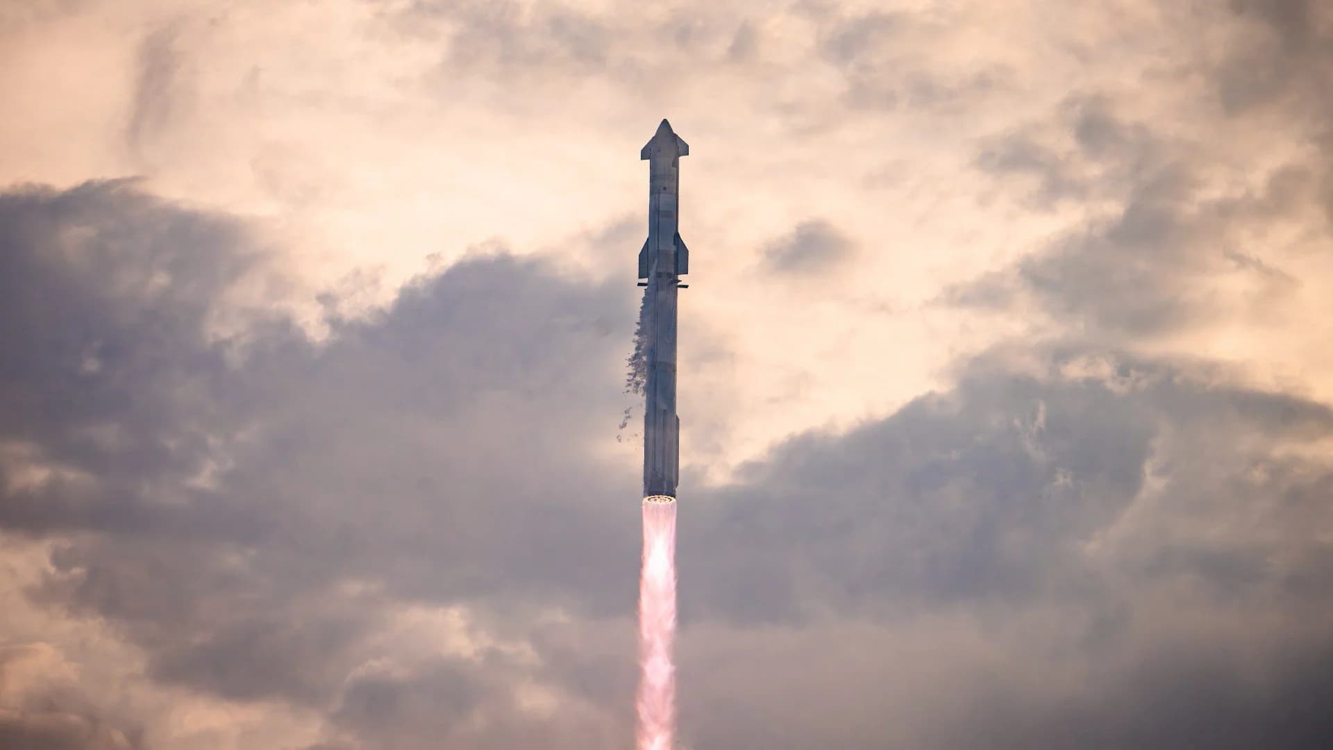SpaceX Starship Flight 11 reentry with exposed steel and plasma glow during heat shield testing