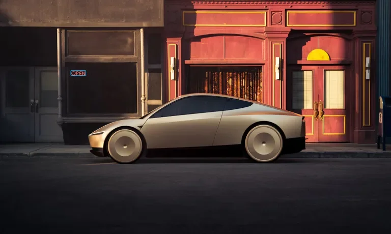 Tesla robotaxi, Optimus humanoid robot, and Megapack storage showing Tesla's real world AI strategy