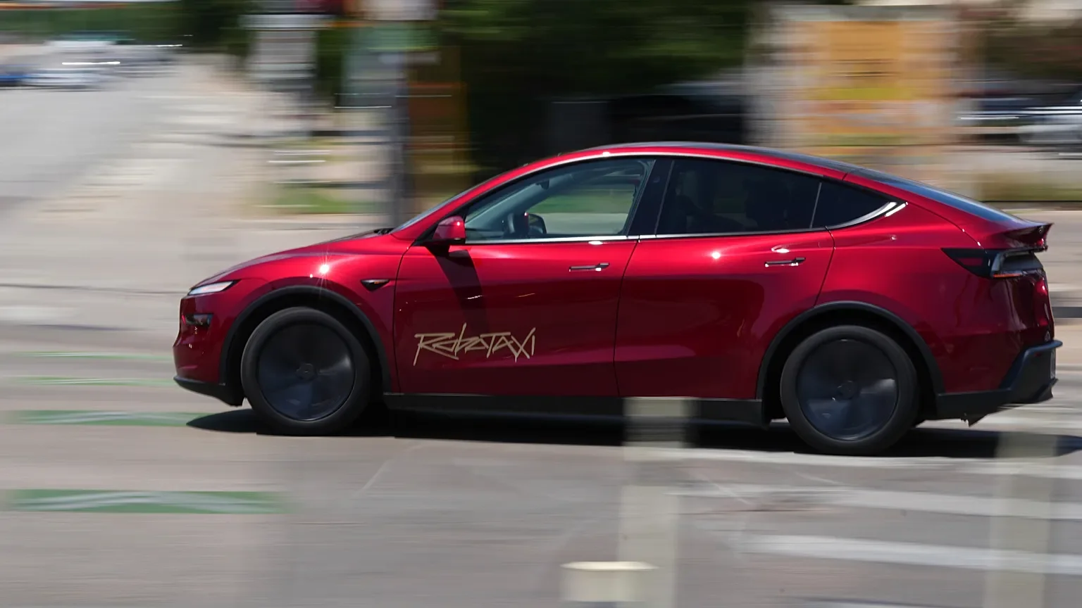 A self-driving car navigating a busy urban street with cameras mapping pedestrians and traffic